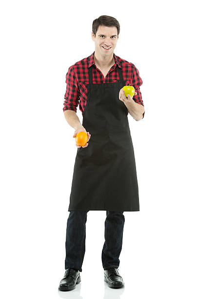 istock Man holding an orange and apple 180713700