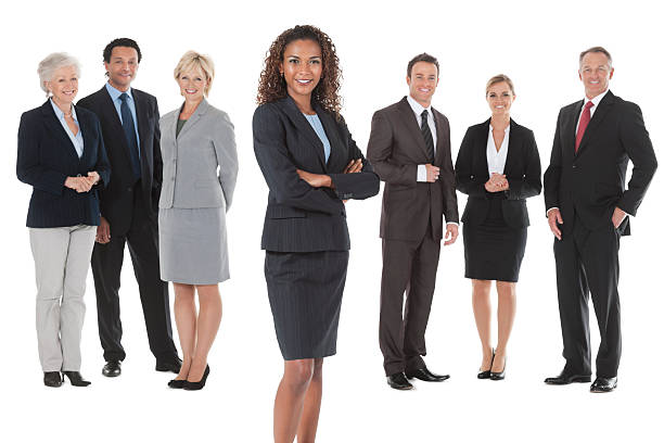 istock Confident Businesswoman With Colleagues Standing Behind 180713791