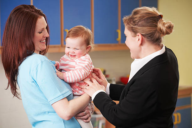Working Mother Dropping Child Off At Nursery