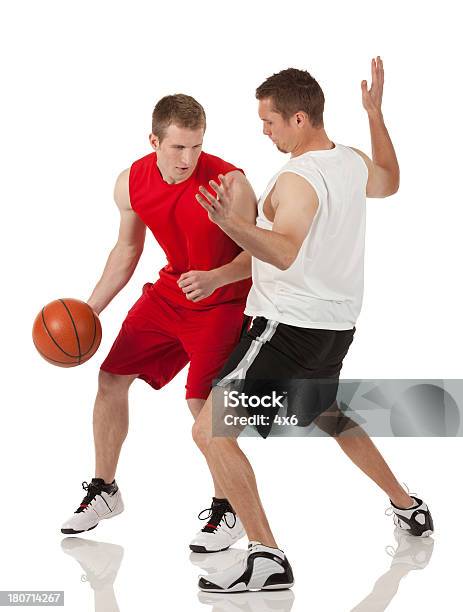 Basketball Players In Action Stock Photo - Download Image Now - 20-29 Years, Activity, Adult