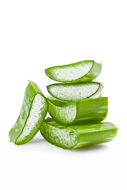 Aloe Vera Sliced Aloe leaf on white background. aloe vera gel stock pictures, royalty-free photos & images