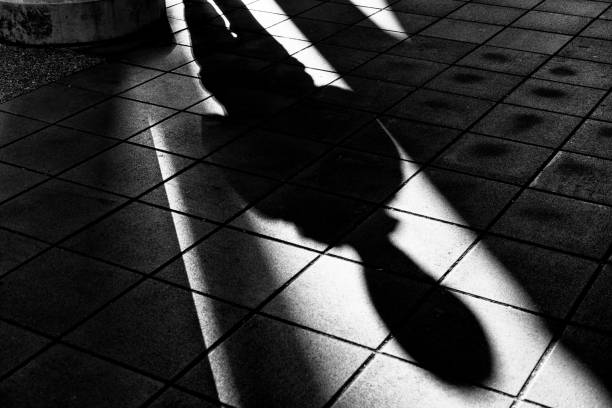 istock Image of a man's shadow on the floor 1807149016