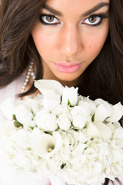 istock Bride holding flower bouquet up close 180714933