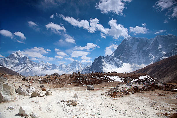 Wonderful day on high mountain.Chukpilhara Sherpa Memorial is located between Dughla & Lobuche. Many stone monuments are builted for memories for Sherpa and other climbers who died on attempt to climb Mount Everest. Gradual ND filter used for this photo