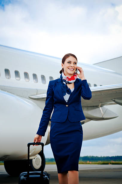 istock Air stewardess talking on phone 180715661