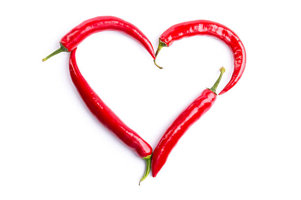 istock red chili peppers heart 180715782
