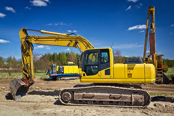istock Yellow excavator in gas pipeline construction 180715978