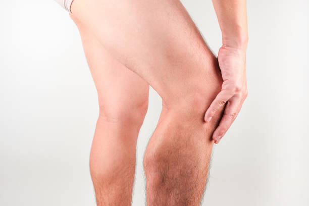 istock Knee pain man He puts his hands on his knees, pain points from osteoarthritis and bone diseases, medical concepts and treatments 1807164705