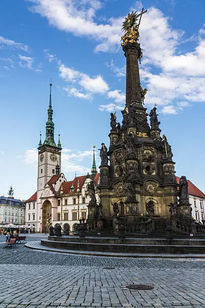 "The Holy Trinity Column in baroque style and Town Hall with astronomical clock. Olomouc Moravia, Czech Republic."