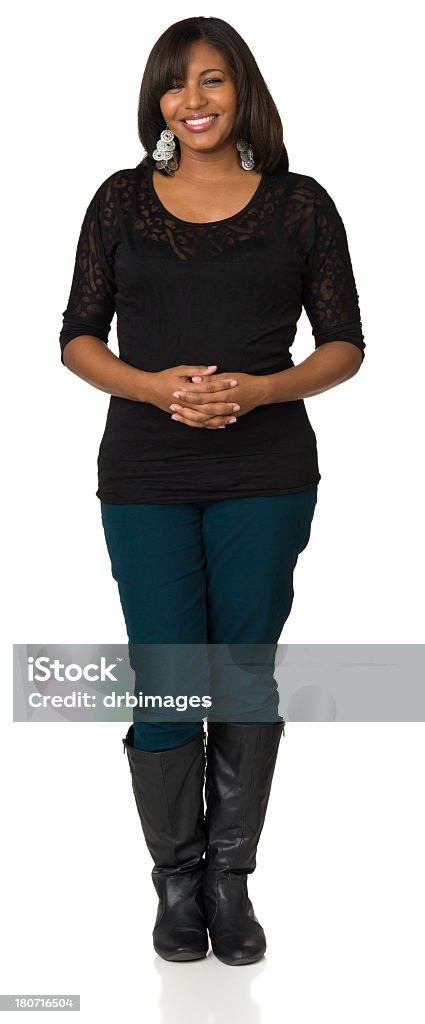 Full-Length Portrait Of Happy Young Woman, Hands Clasped Portrait of a young African-American woman on a white background. 20-24 Years Stock Photo