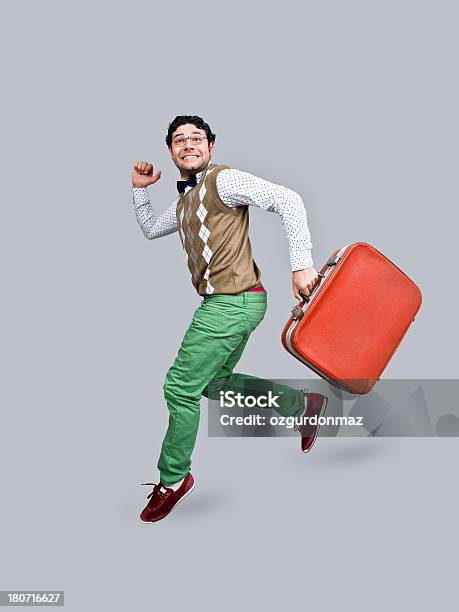 Nerd In Air Holding Suitcase Stock Photo - Download Image Now - Jumping, Studio Shot, Running