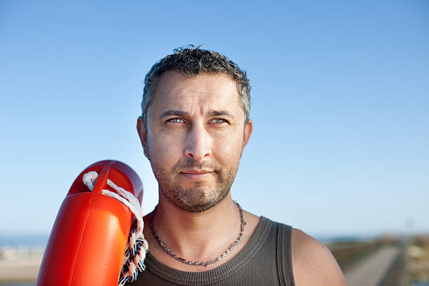 istock Man with a life buoy 180717390