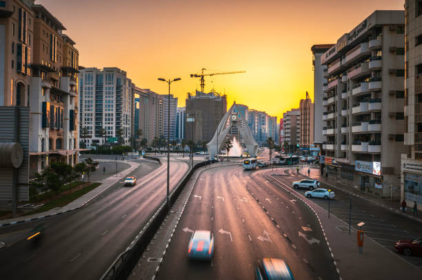 Dubai, United Arab Emirates - May 11, 2021: Deira Clock Tower roundabout and the charming city streets in Old Dubai come to life during the serene blue hour.