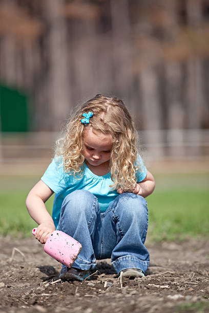 istock Girl Digging in Dirt 180717775