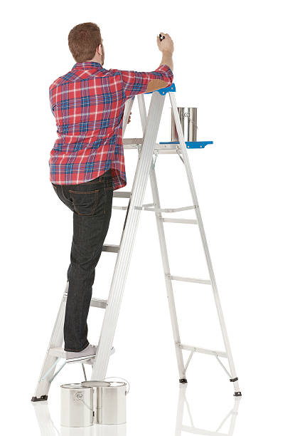 istock Male painter painting a wall 180718303