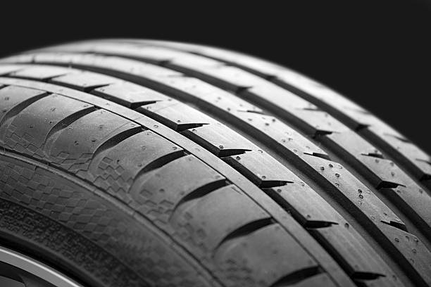 istock new car tire profile on black background 180718520