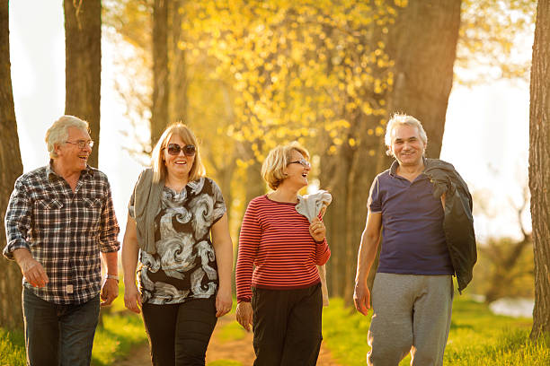 istock Four seniors walking outdoors 180718604