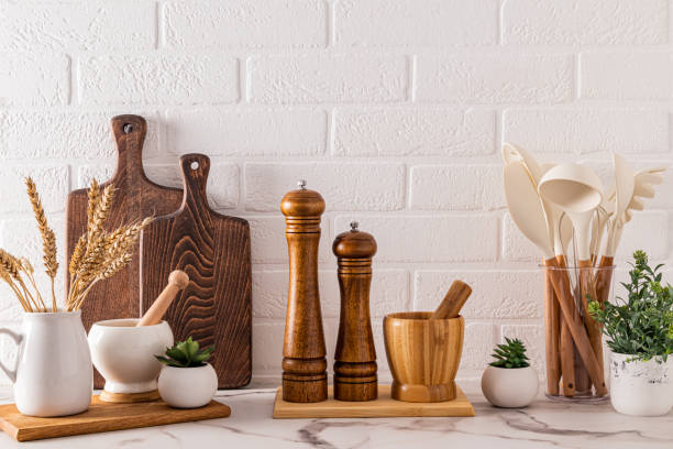 istock Various wooden kitchen utensils and cooking tools on the marble countertop. Front view. Stylish kitchen background. 1807192271