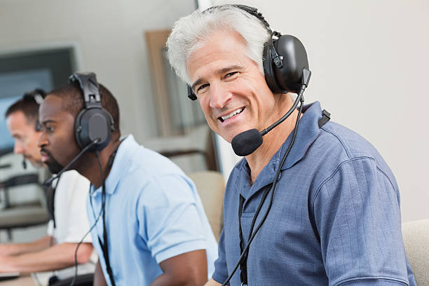 istock Smiling sportscaster in the sporting event press box 180719685