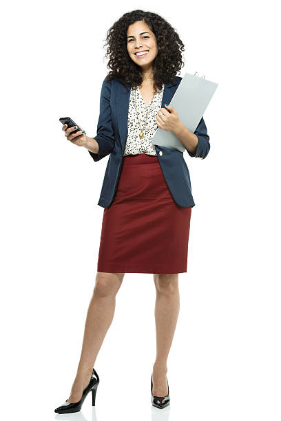 istock Businesswoman posing with a clipboard and cell phone 180720007