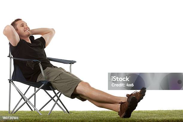 Man Resting On Chair In A Lawn Stock Photo - Download Image Now - Sitting, White Background, One Person