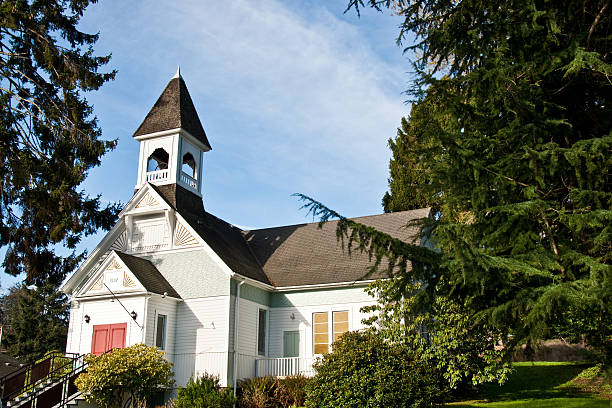 Burton Community Church (1897) The First Baptist Church of Burton was built in 1897 on land acquired by a land grant. In 1928, the church was reorganized and renamed the Burton Community Church. This more accurately reflected the diverse religious backgrounds of the member. Burton Community Church is located on Vashon Island in Burton, Washington State, USA. jeff goulden church stock pictures, royalty-free photos & images