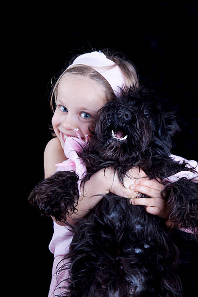 istock Girl holding her dog 180721302