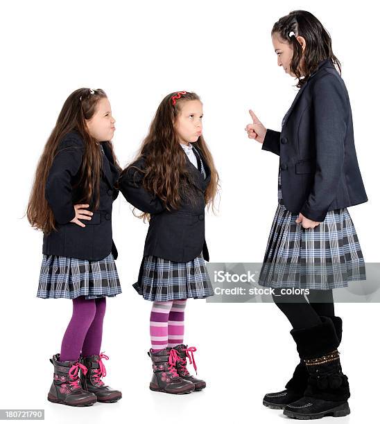 Foto de Professor Com Os Alunos Discutir e mais fotos de stock de Desrespeito - Desrespeito, Estudante, Uniforme