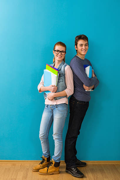 Smiling teen students