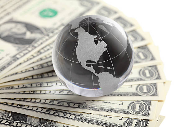 istock glass globe and money 180722154