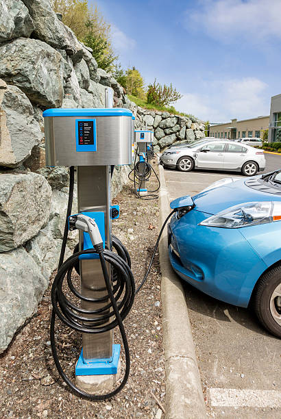 Electric cars parked at a business charging station stock photo