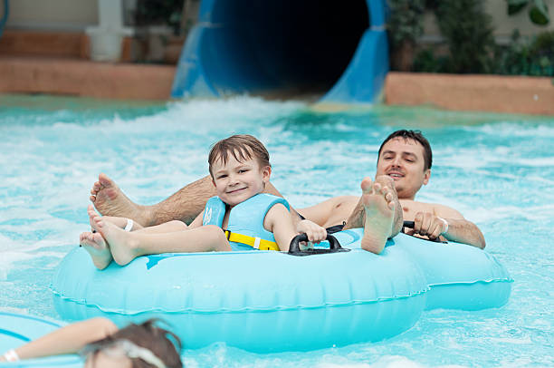 istock Father and son in a waterpark 180722654