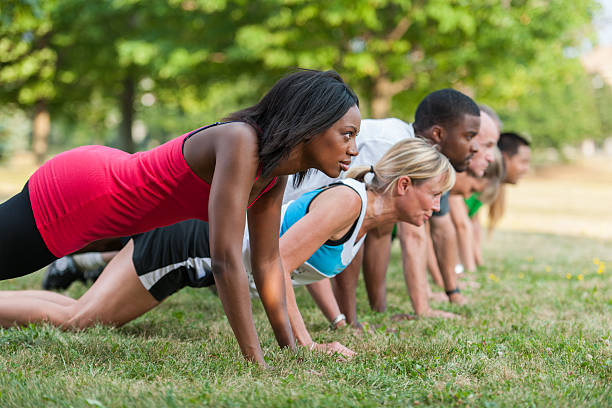 Outdoor Fitness Class Diverse outdoor fitness class barracks photos stock pictures, royalty-free photos & images