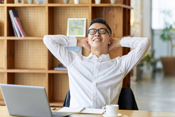 Asian businessman relaxing at a cafe