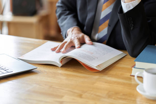 istock Asian businessman reading at a cafe to study 1807228981