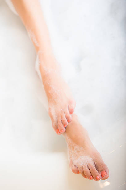 istock Feet in bath tub 180722926