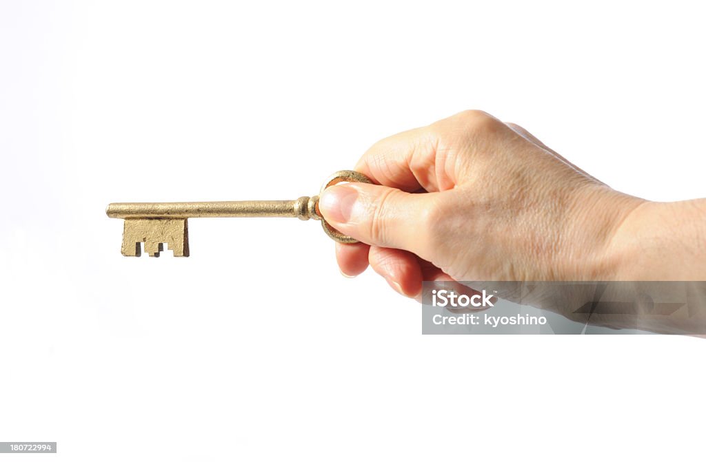 絶縁ショットを持つアンティークの合鍵、ホワイト - カットアウトのロイヤリティフリーストックフォト