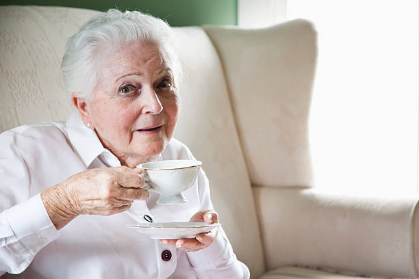 istock Elderly woman with cup of tea 180723349