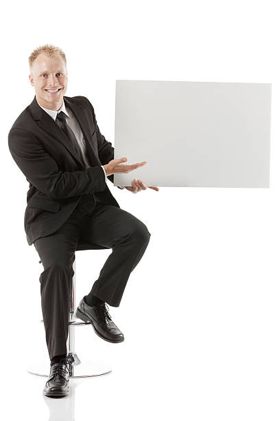 istock Businessman holding a blank placard 180723450