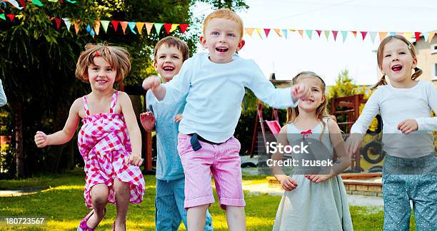 Kids Jumping Outside Stock Photo - Download Image Now - 4-5 Years, Active Lifestyle, Activity