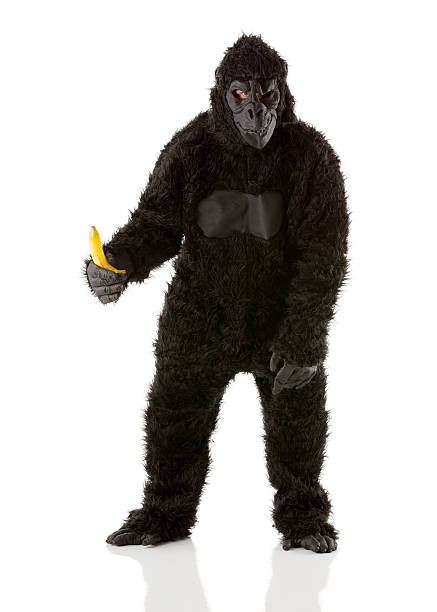 uomo in costume con banana gorilla - men banana holding cut out foto e immagini stock