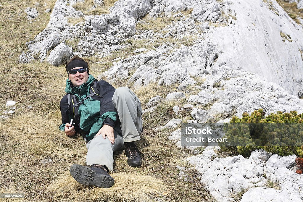 Hiker resting during ascent Achievement Stock Photo