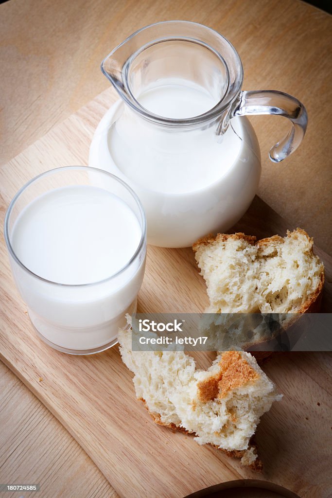 milk and bread milk jug and glass of milk Milk Jug Stock Photo