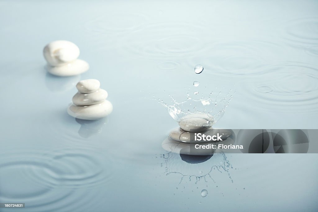 zen rain Zen-like composition with pebbles and water crown. Balance Stock Photo