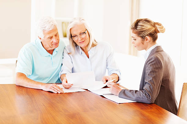 istock Couple Analyzing Investment Scheme With Advisor 180725303