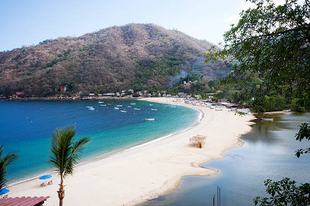 Yelapa Fishing Village Puerto Vallarta, Mexico "The small fishing village of Yelapa on the Bay of Banderas, near Puerto Vallarta, Mexico.  This small village is only accessible by boat.All images in this series..." pacific coast stock pictures, royalty-free photos & images