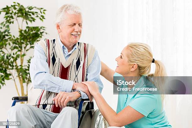 Senior Man With Wheelchair And Caregiver Stock Photo - Download Image Now - Adult, Adults Only, Aging Process