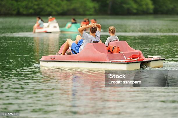 Kids Using Pedal Boat On Lake Stock Photo - Download Image Now - Pedal Boat, Adult, Boys