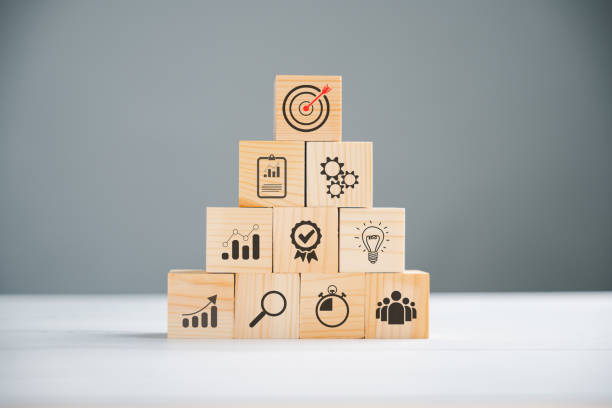 istock Wooden block cude step on table with Action Plan 1807261262