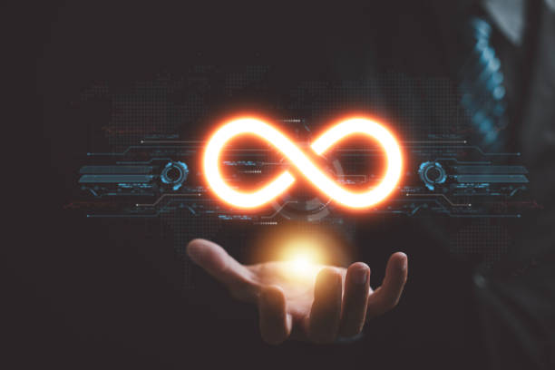 Circular infinity symbol in businessman's hand on dark background